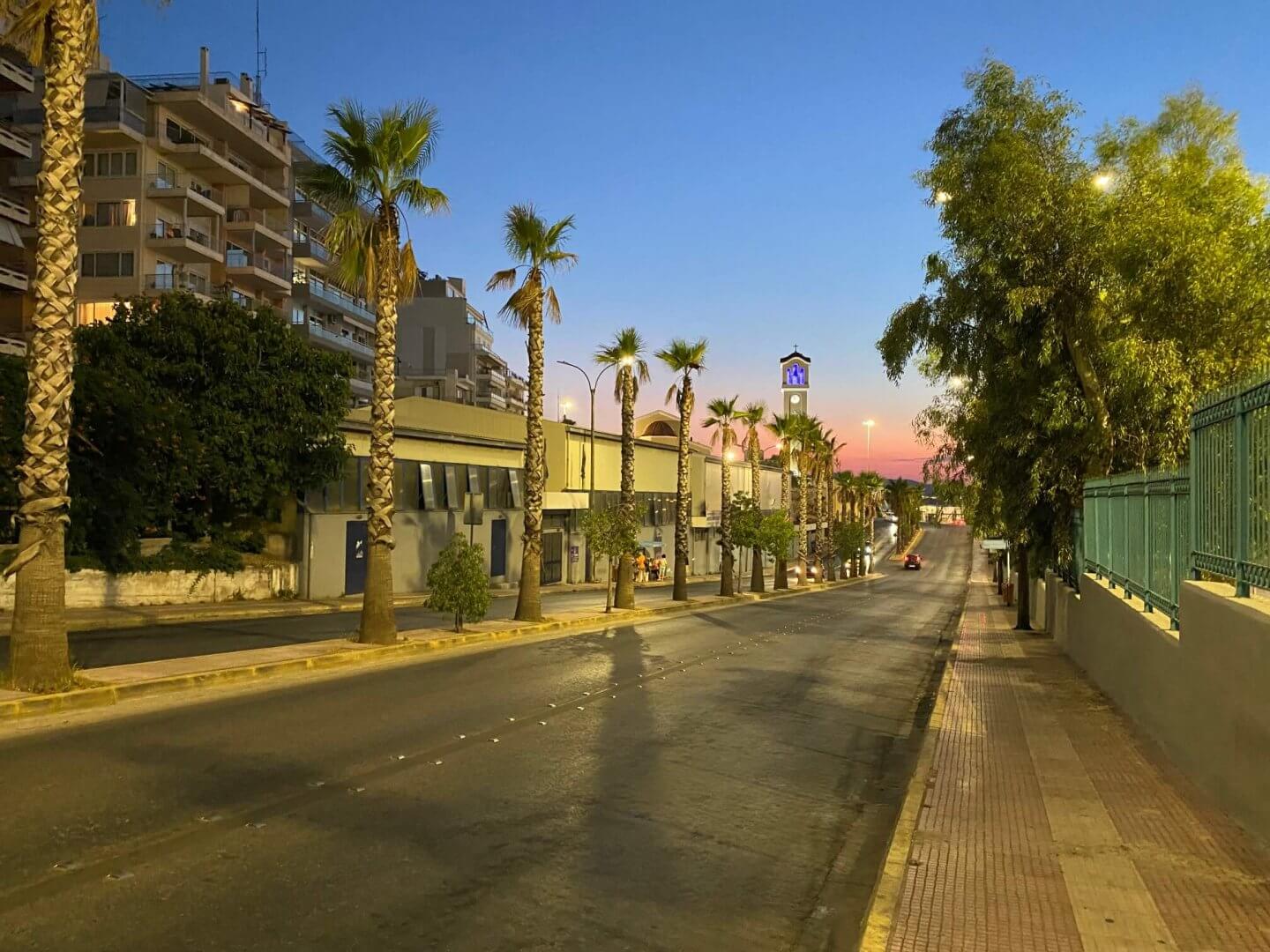 Palm tree lined street at sunset