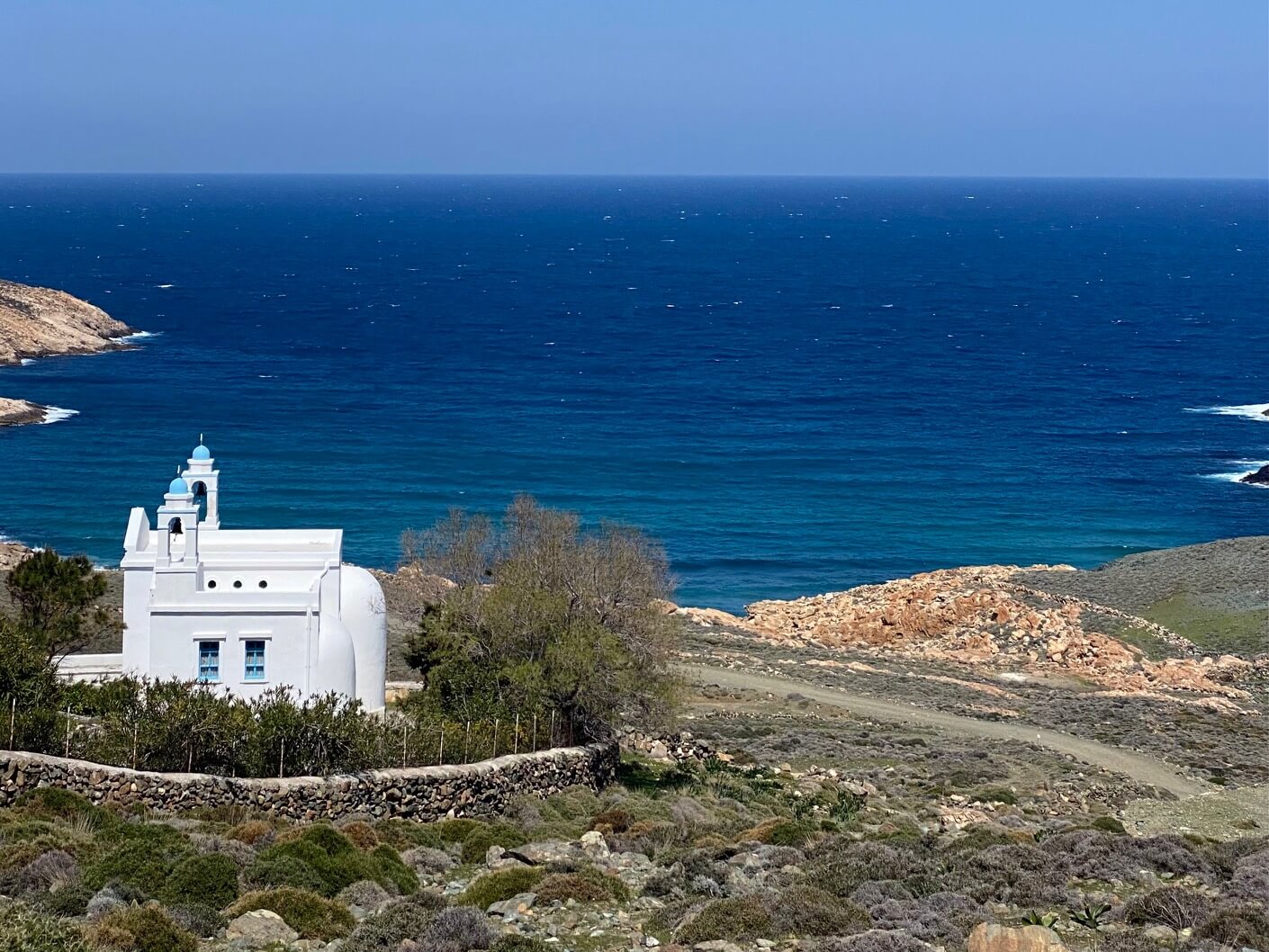 Small white chapel on edge of island