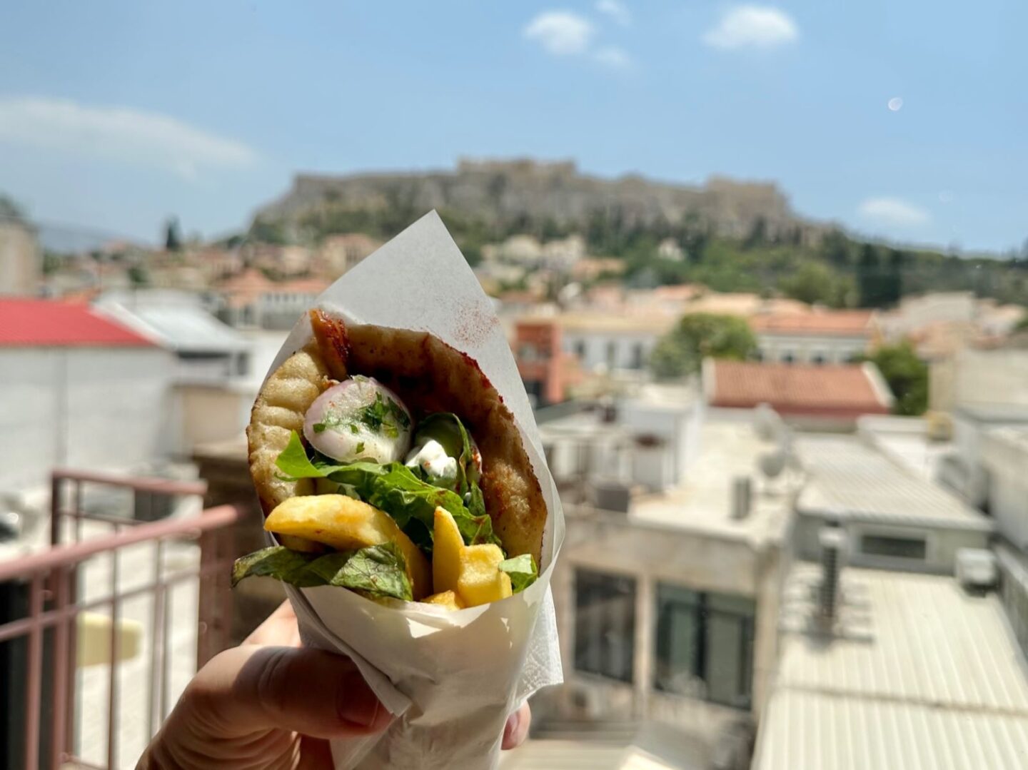 Gyros held in front of the Acropolis