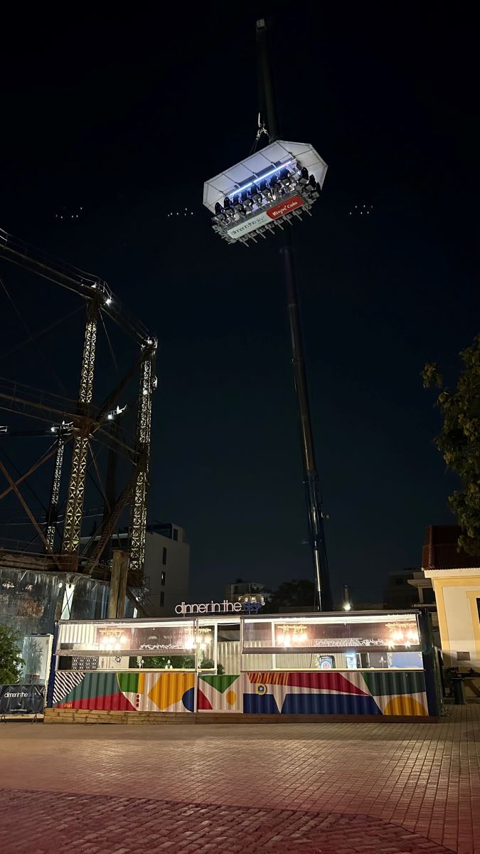 Dinner in the sky with platform elevated on the crane